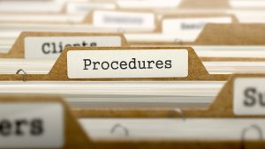 folder with procedures written on the tab